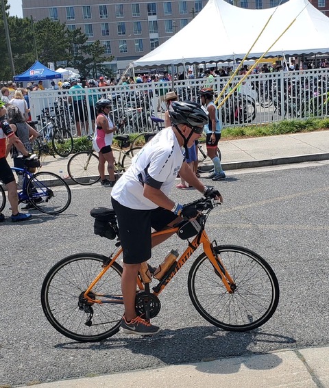 Jay Comly pedaling for progress.